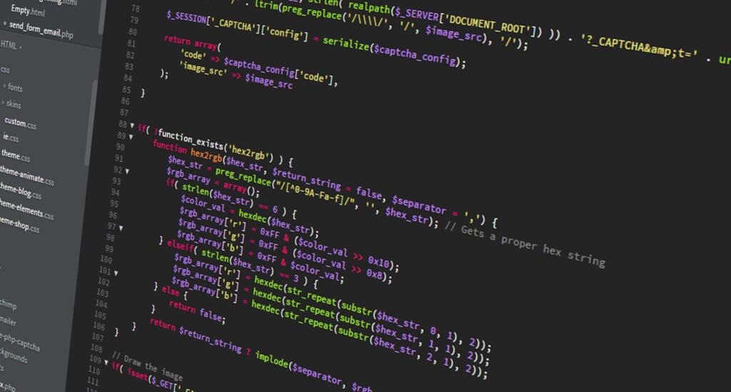 Colourful PHP source code on a dark computer screen.